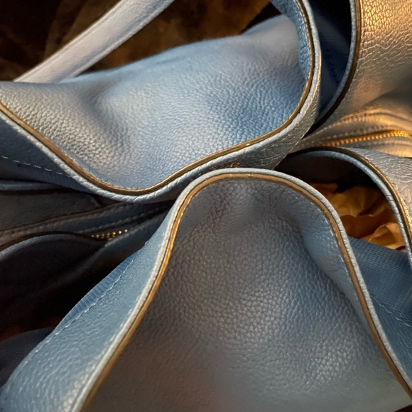 The Coach Edie bag soft slouchy silhouette style with functional design. - Picture 9 of 13